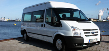 9-seater Ford Transit schoolbus from JOYRIDE in front of the port in Rostock